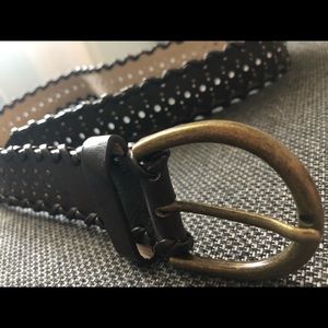 Brown belt with whole throughout entire thing